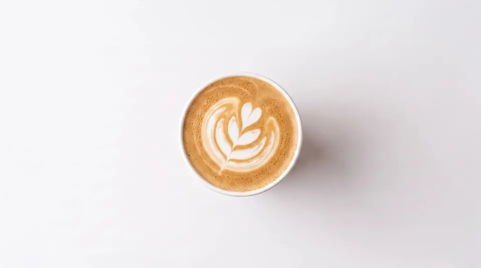 Cappuccino from above with leaf-shaped latte art
